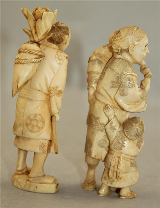 Three Japanese ivory groups of figures, early 20th century, 22cm., latter with wood stand
